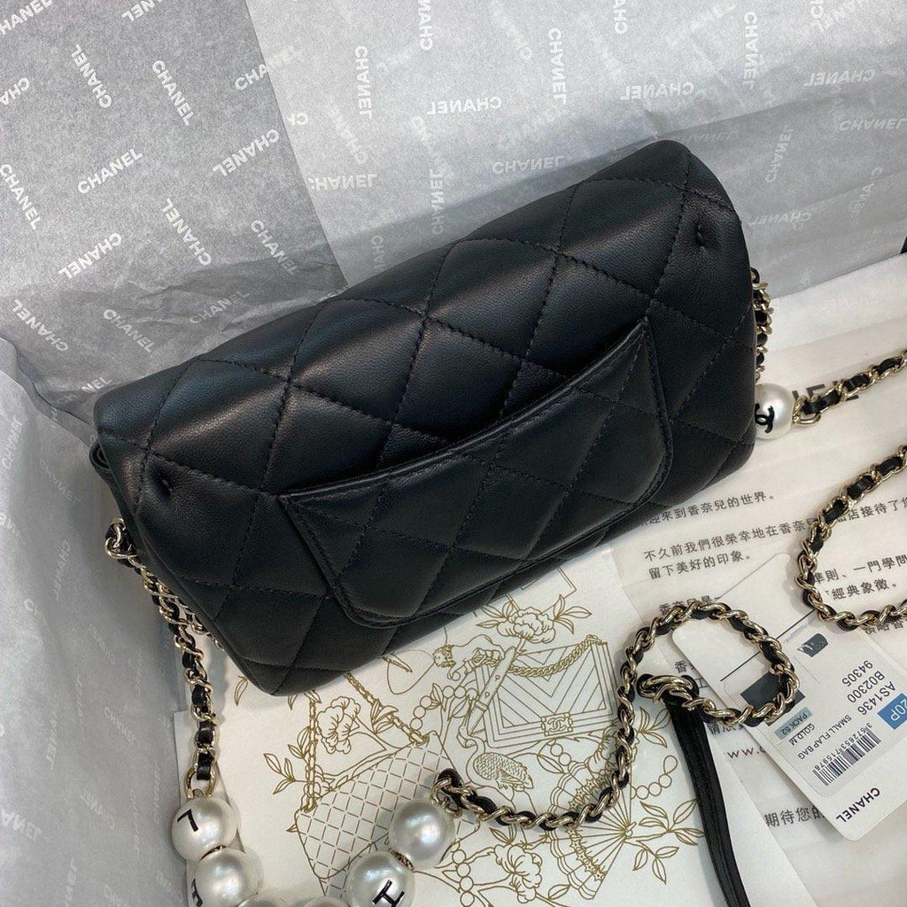 Chanel Pearl Logo Strap Flap Bag Black